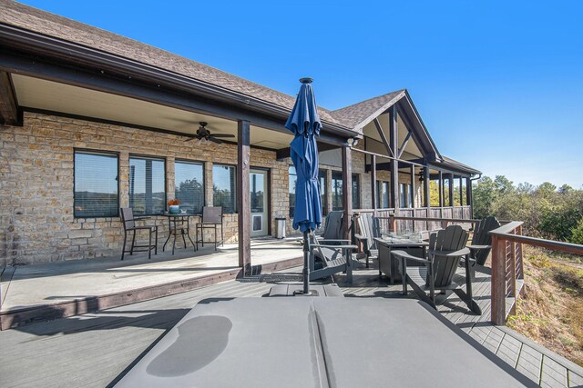 exterior space with ceiling fan and a patio