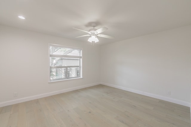 unfurnished room featuring light hardwood / wood-style floors and ceiling fan