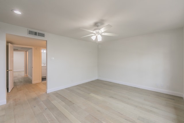 unfurnished room featuring ceiling fan and light hardwood / wood-style floors