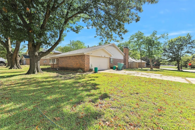 view of home's exterior with a garage and a yard