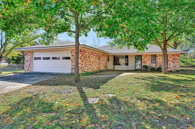 single story home featuring a front lawn and a garage