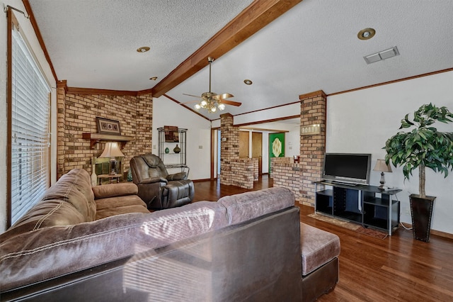 living room with a textured ceiling, lofted ceiling with beams, dark hardwood / wood-style floors, and ceiling fan