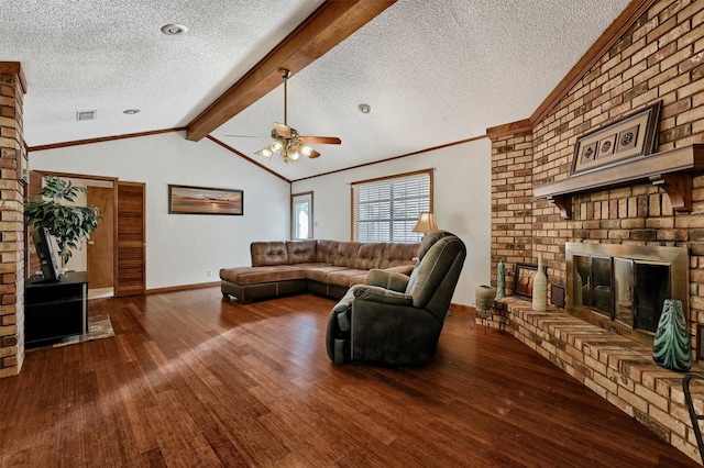 living room with a brick fireplace, wood-type flooring, a textured ceiling, and lofted ceiling with beams