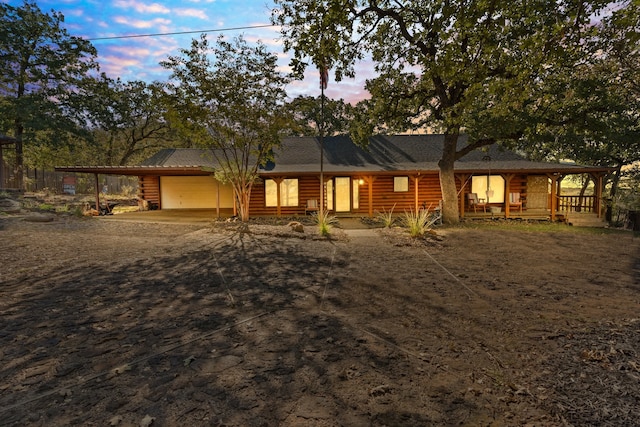 view of front of home with a carport