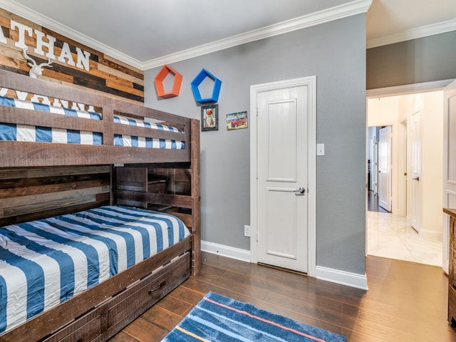 bedroom with dark wood-type flooring and crown molding