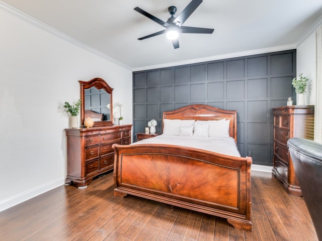 bedroom with ceiling fan, dark hardwood / wood-style flooring, and ornamental molding