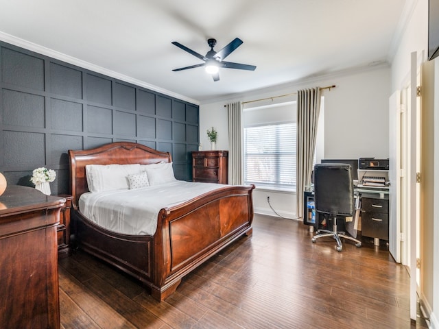 bedroom with dark hardwood / wood-style flooring, ceiling fan, and crown molding