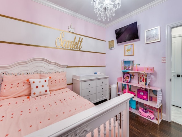 bedroom featuring dark wood-type flooring, a chandelier, and crown molding