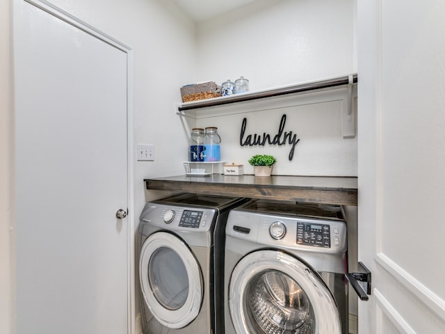 clothes washing area with washer and dryer