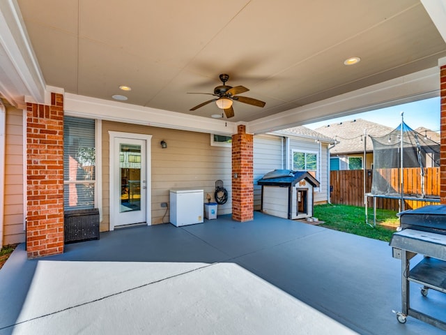 view of patio / terrace featuring ceiling fan and a trampoline