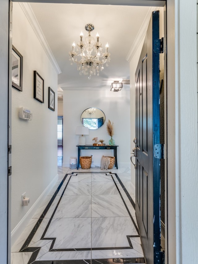 hallway with an inviting chandelier and ornamental molding