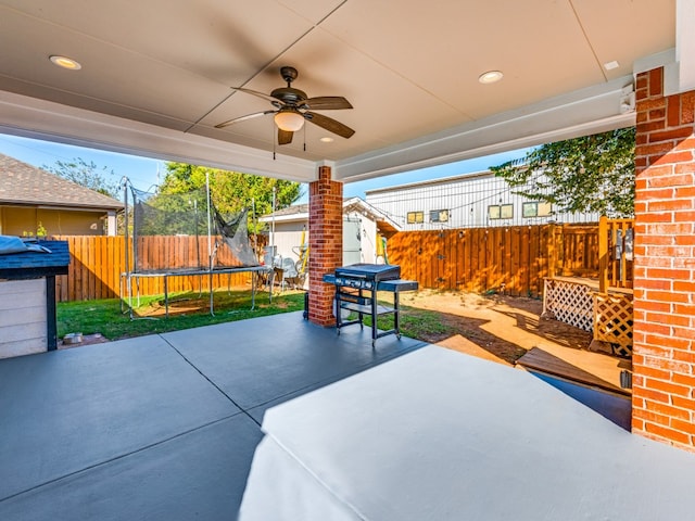 view of patio with a trampoline and ceiling fan