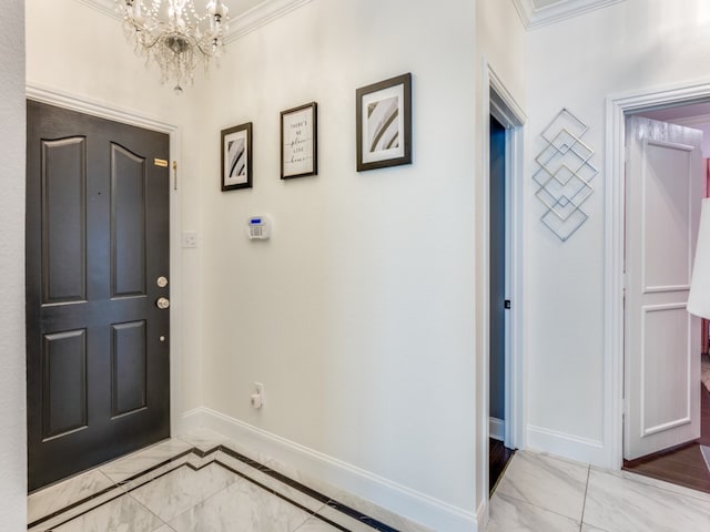 entryway featuring an inviting chandelier and ornamental molding