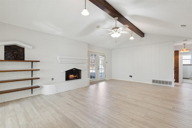 unfurnished living room featuring french doors, a fireplace, vaulted ceiling with beams, light wood-type flooring, and ceiling fan