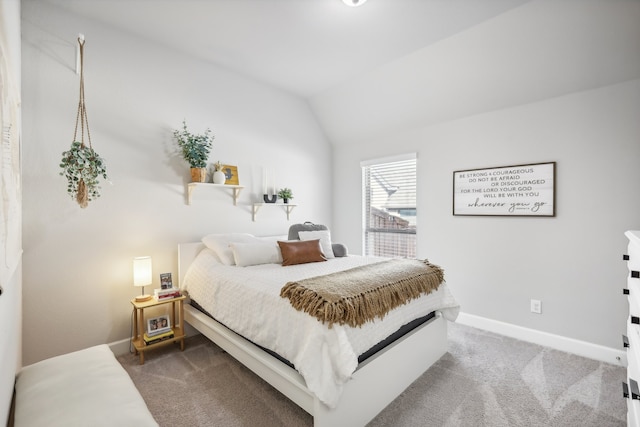 bedroom featuring carpet floors and lofted ceiling