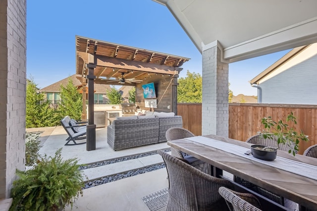 view of patio / terrace with an outdoor kitchen, outdoor lounge area, area for grilling, and a pergola