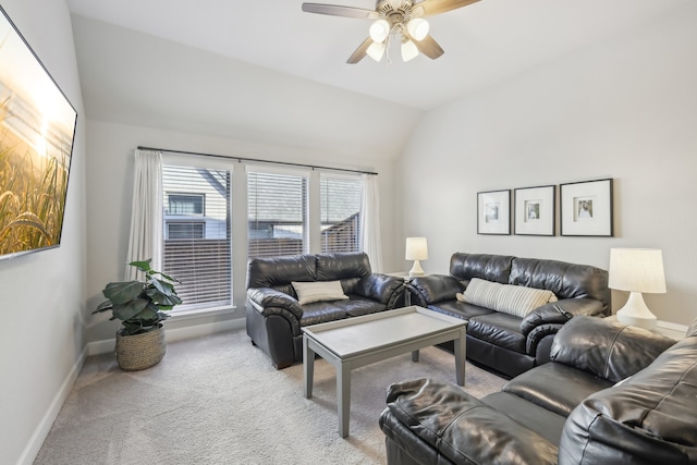 living room featuring light carpet, ceiling fan, and vaulted ceiling