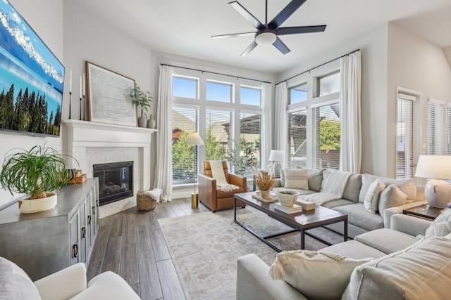 living room with hardwood / wood-style floors, ceiling fan, and plenty of natural light