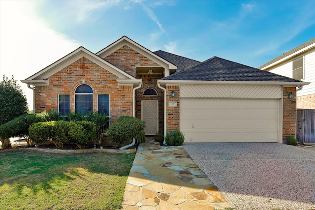 view of front of home featuring a garage and a front yard