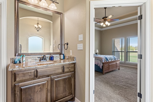 bathroom featuring vanity, ceiling fan, and crown molding