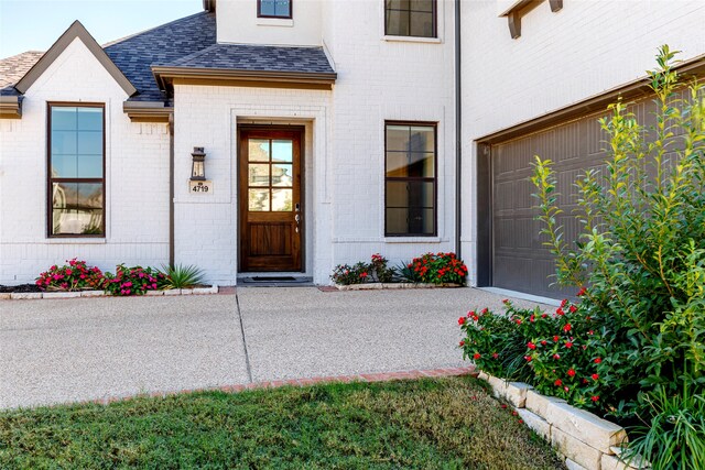 view of exterior entry featuring a garage