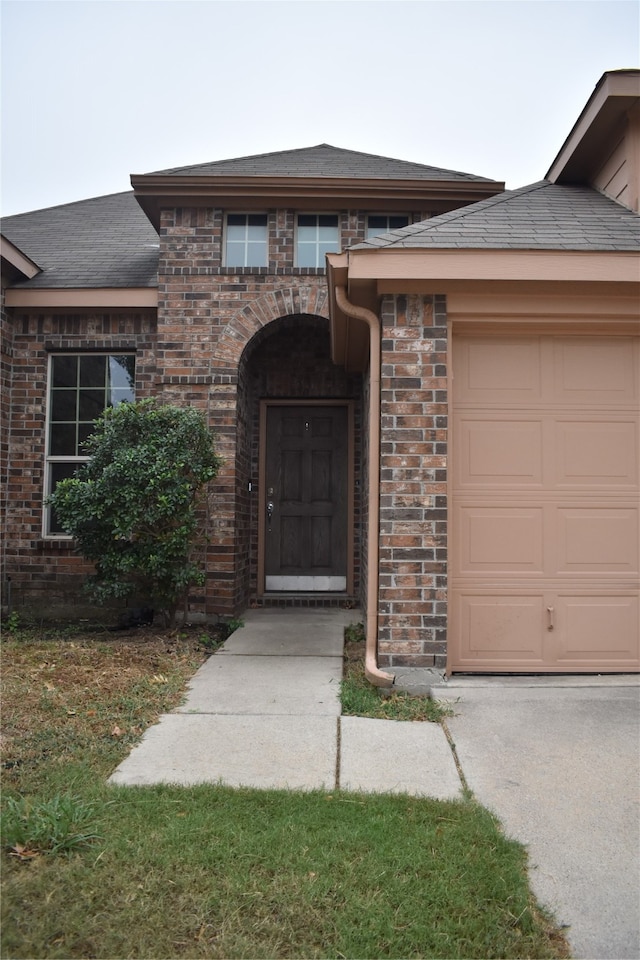 entrance to property featuring a garage