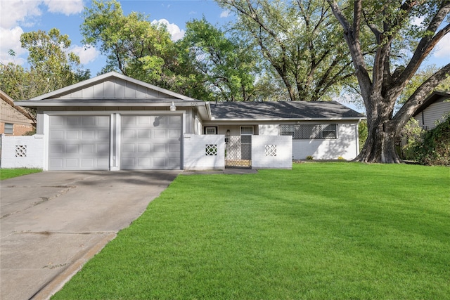 ranch-style home with a garage and a front yard