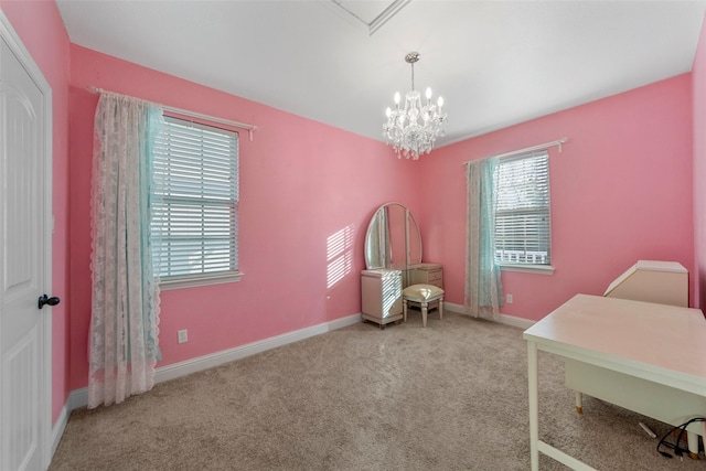 carpeted office space featuring a notable chandelier