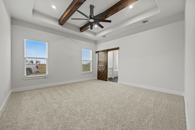 unfurnished bedroom with beam ceiling, carpet flooring, visible vents, and baseboards