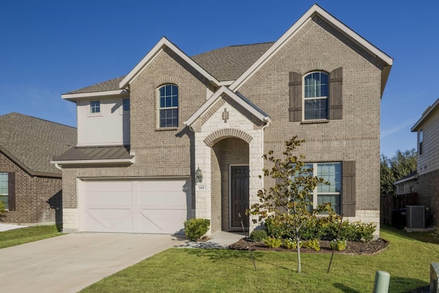 view of front facade featuring a front lawn and a garage