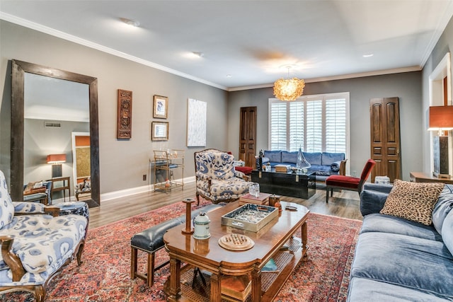 living room with crown molding and light hardwood / wood-style flooring