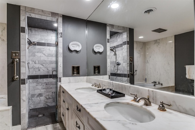 bathroom featuring vanity and a shower with door