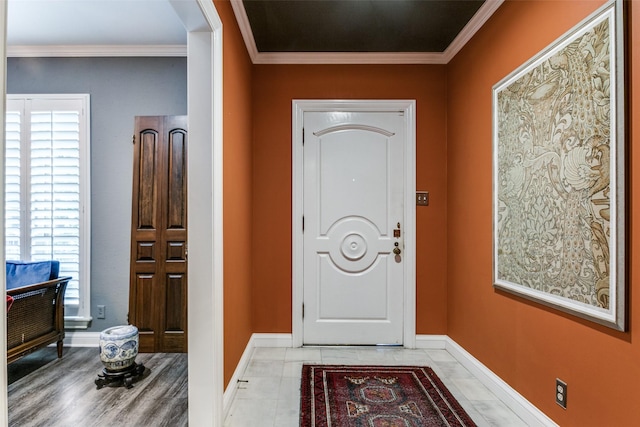 foyer featuring ornamental molding