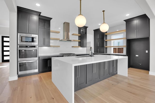 1719 Silver Marten Trl, Arlington, TX 76005 - kitchen featuring open shelves, light wood-style floors, wall chimney exhaust hood, appliances with stainless steel finishes, and a sink