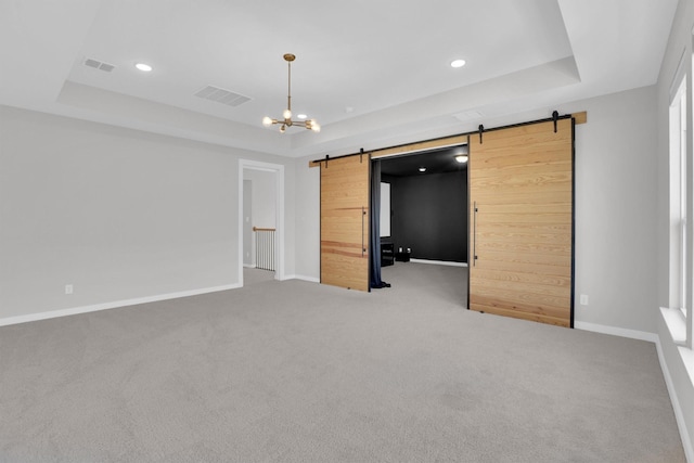 1719 Silver Marten Trl, Arlington, TX 76005 - unfurnished bedroom with a tray ceiling, visible vents, and a barn door