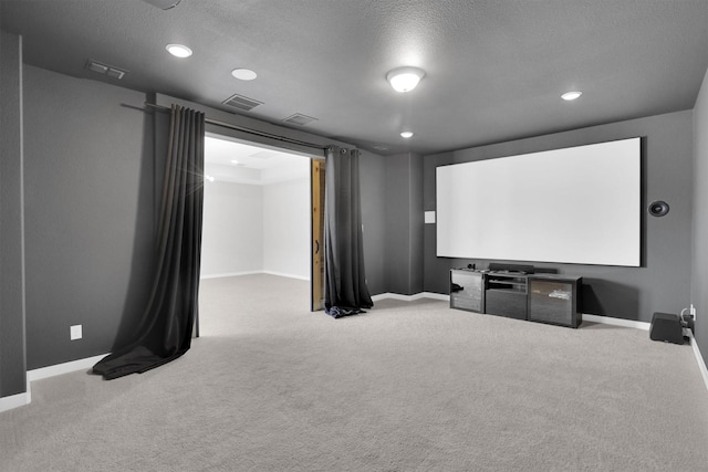 1719 Silver Marten Trl, Arlington, TX 76005 - carpeted home theater featuring recessed lighting, visible vents, baseboards, and a textured ceiling