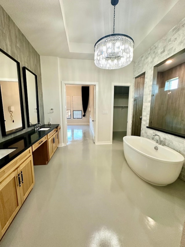 bathroom with vanity, shower with separate bathtub, and concrete floors