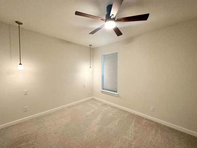 carpeted empty room with ceiling fan