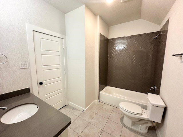 full bathroom with vanity, vaulted ceiling, tile patterned flooring, tiled shower / bath combo, and toilet