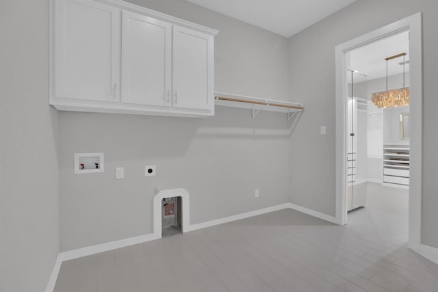 1719 Silver Marten Trl, Arlington, TX 76005 - laundry room featuring electric dryer hookup, baseboards, hookup for a washing machine, and cabinet space