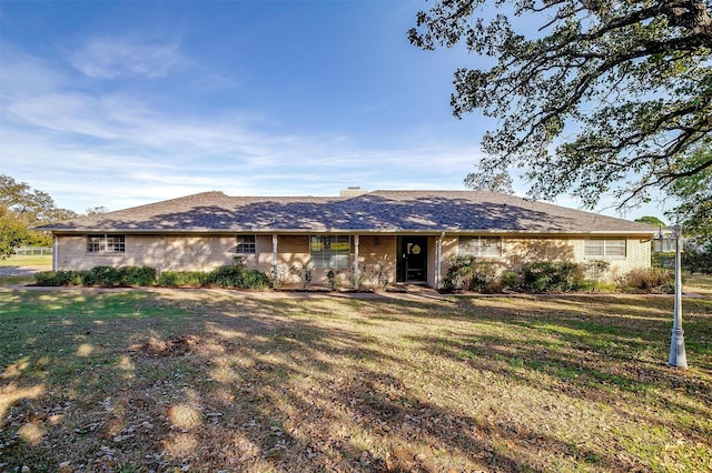 ranch-style house featuring a front lawn