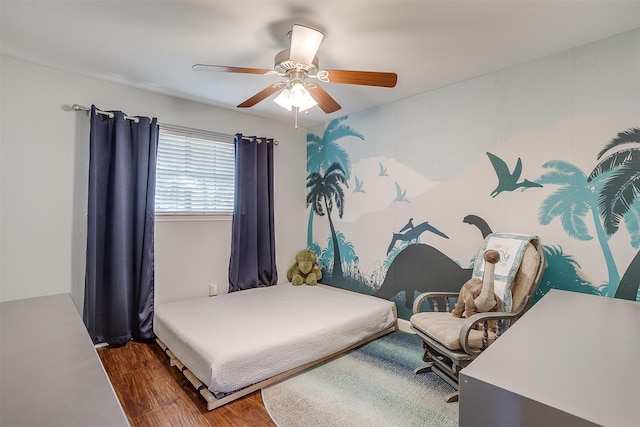 bedroom featuring ceiling fan and dark wood-type flooring