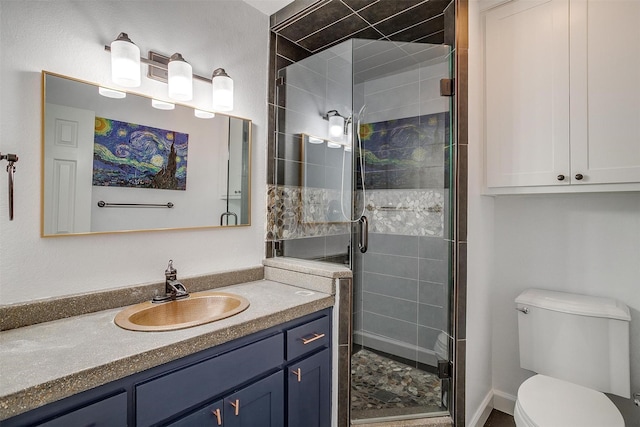 bathroom featuring walk in shower, vanity, and toilet