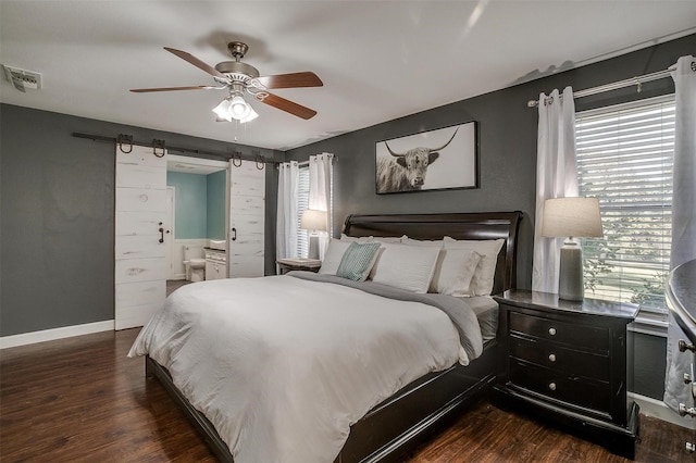 bedroom with ceiling fan and dark hardwood / wood-style floors