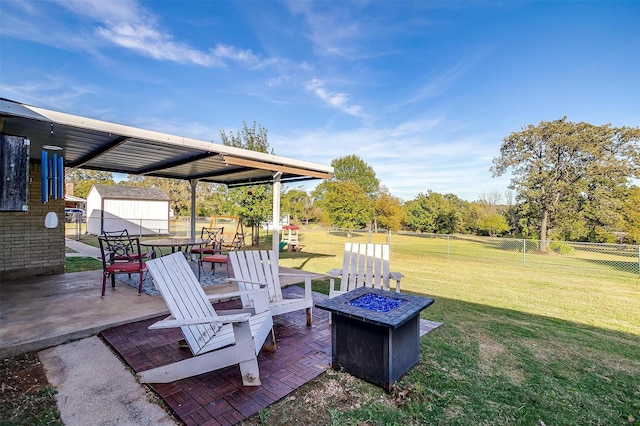 view of patio featuring an outdoor fire pit