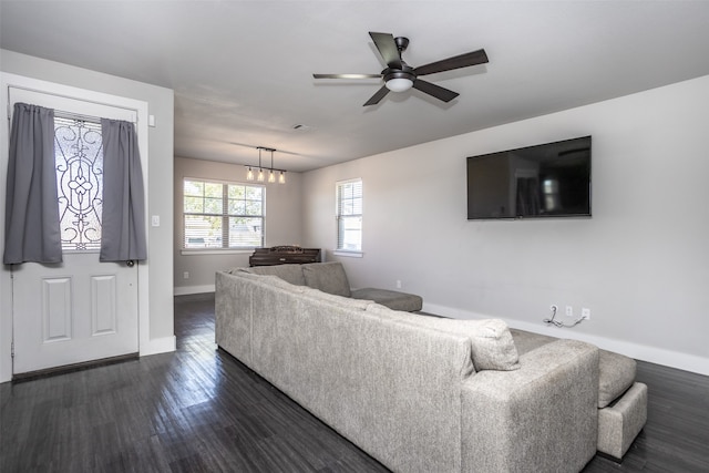 living room featuring dark hardwood / wood-style floors and ceiling fan