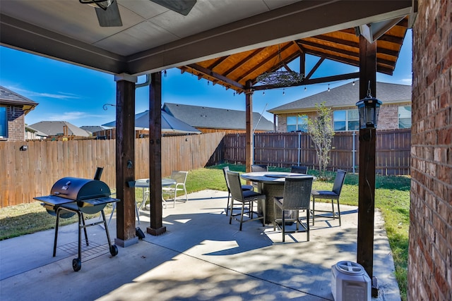 view of patio / terrace featuring a grill and ceiling fan