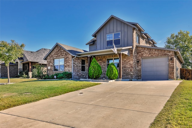 view of front of house featuring a front lawn and a garage