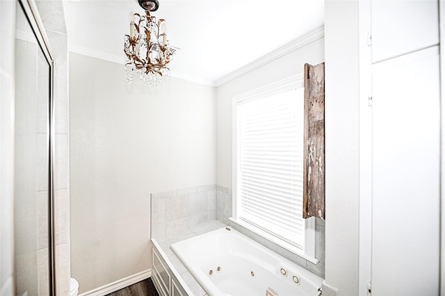 bathroom with wood-type flooring, toilet, a notable chandelier, tiled tub, and ornamental molding