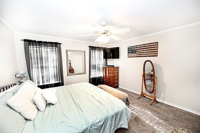 bedroom with carpet flooring, ceiling fan, and crown molding